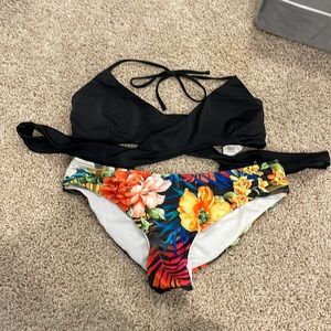 Women’s bikini. Black top. Floral bottoms